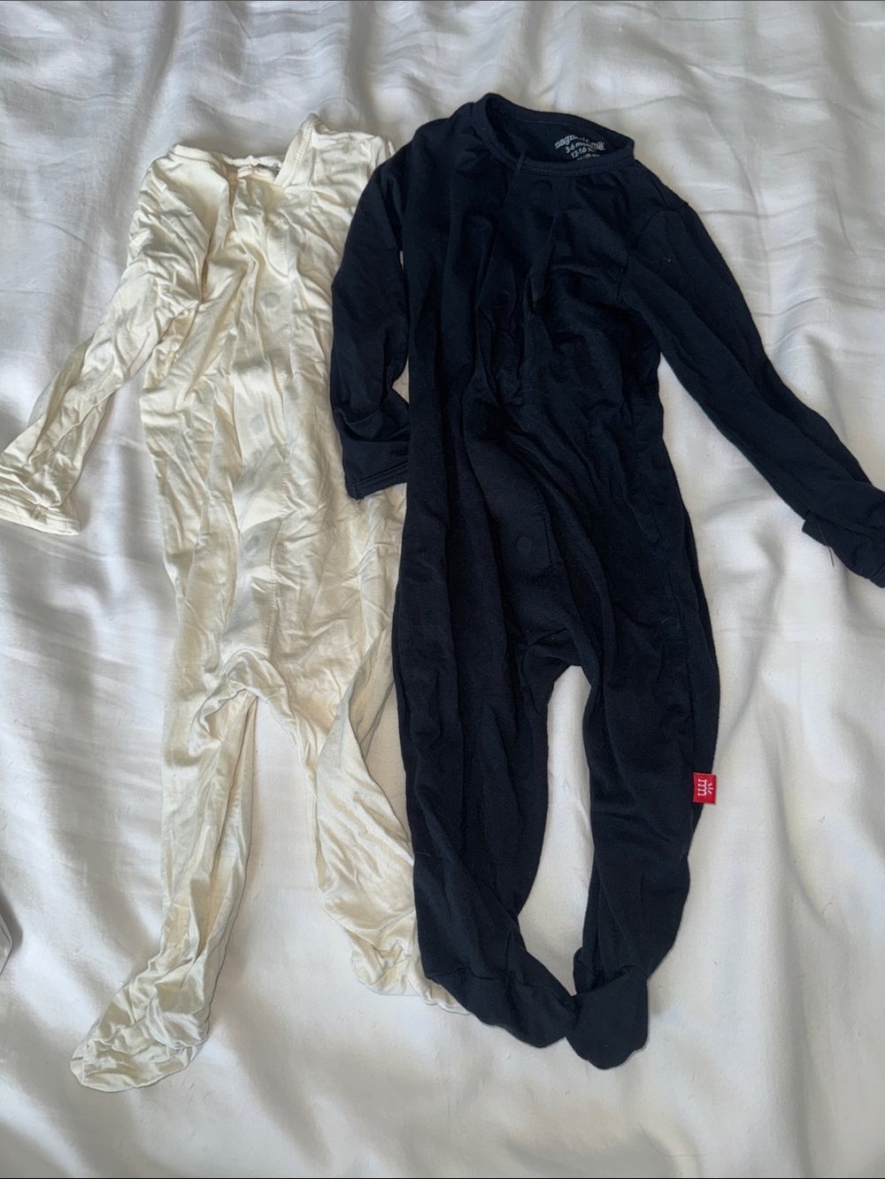 Magnetic me cream and black long sleeves footed onesies sz 3-6 months